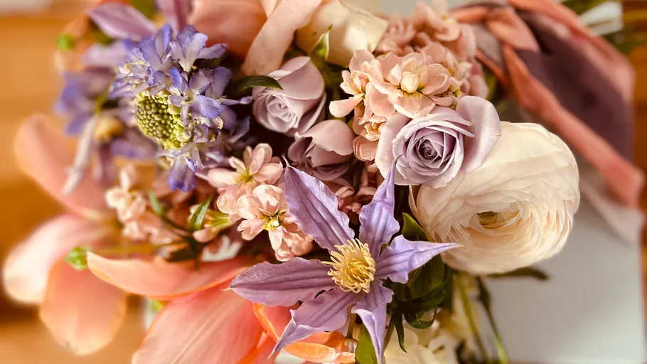 Colorful bouquet with pink and purple flowers.