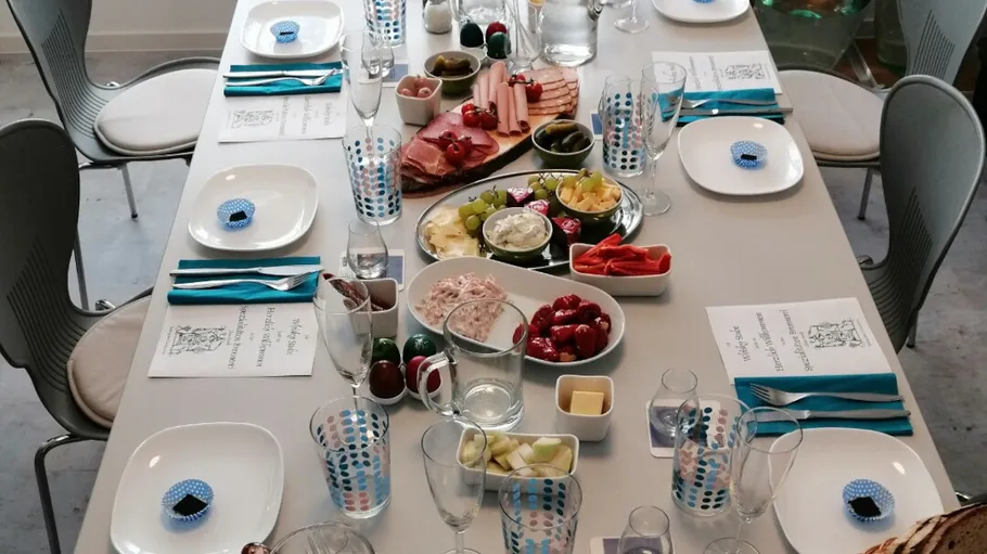 Table set with appetizers and drinks.