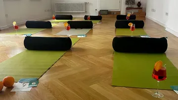 Yoga mats with drinks in a studio.