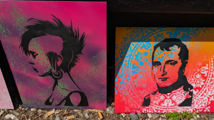 Two stencil artworks, one portrait, colorful background.