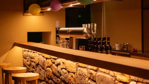 Bar counter with stools and decorations.