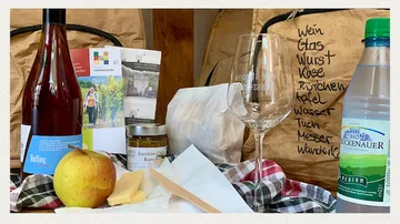 Food and drink items on a wooden table.