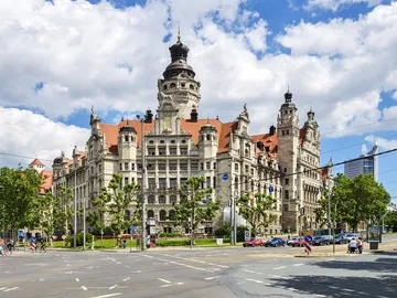 Historic building stands majestically under blue skies.