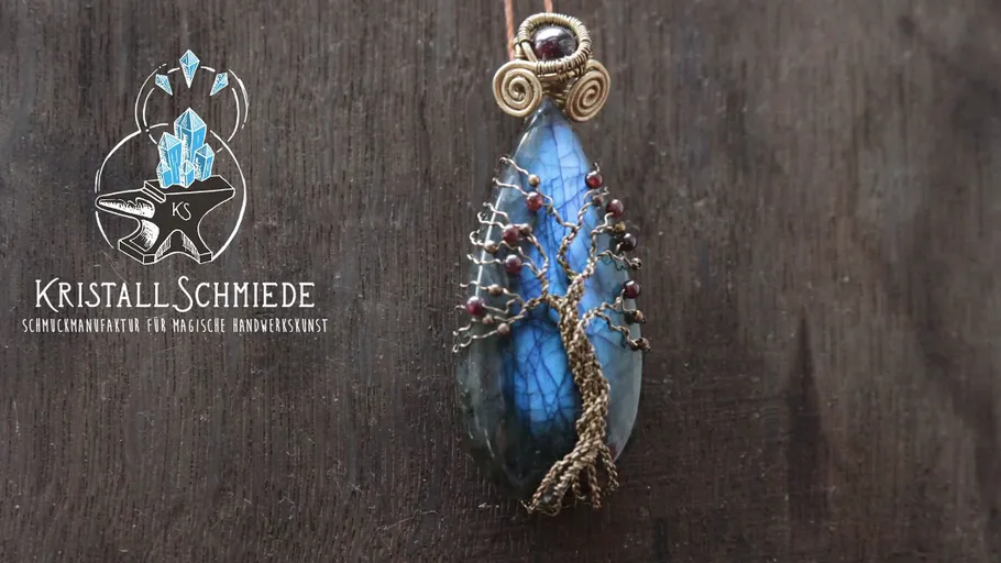 Tree pendant with wire on blue stone.