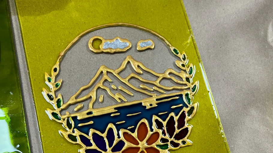 Colorful mountain design on yellow background.