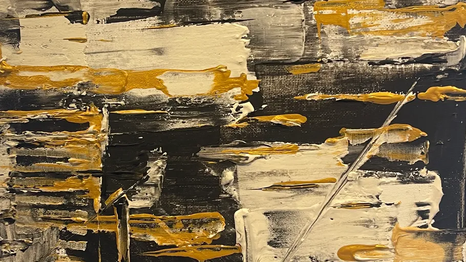 Abstract painting with gold, white, black brushstrokes.