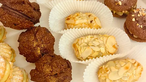 Various cookies on a white plate.
