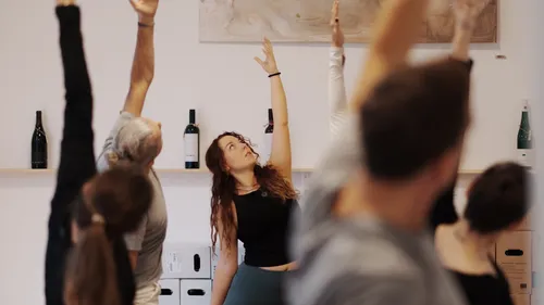 People practicing yoga in a studio setting.