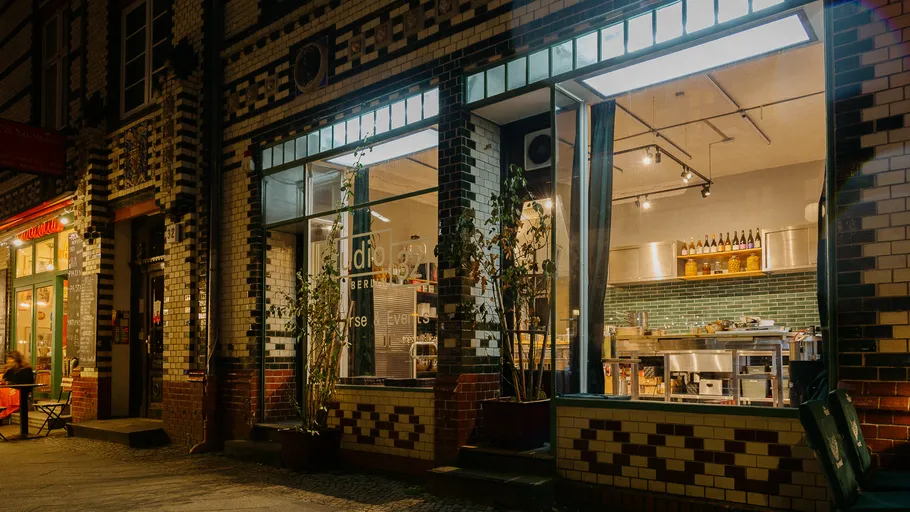 Street view of restaurants at night.
