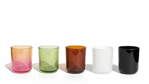 Five colorful glass cups on white background.