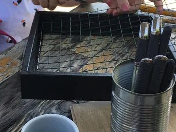 A cage is built to hold objects.