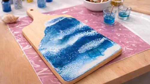 Resin art on wooden cutting board, table.
