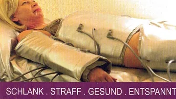 Woman in spa suit, lying down relaxed.