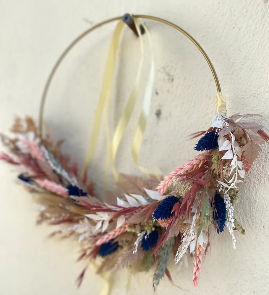 Floral hoop wreath with dried flowers.