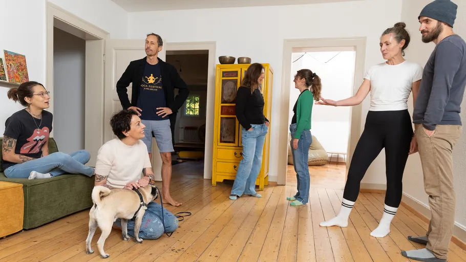 People talking in a living room.