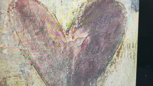 Abstract heart shape on textured background.