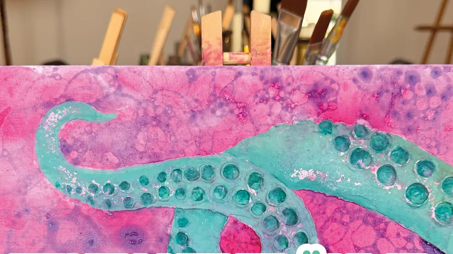 Painting of tentacles on easel in classroom.