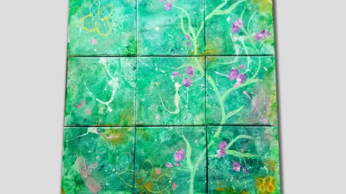 Abstract green artwork with purple flowers.