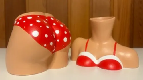 Beach-themed clay model with red polka dots.