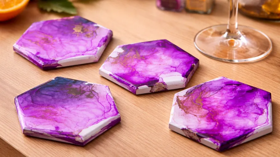 Purple hexagonal coasters on wooden table.