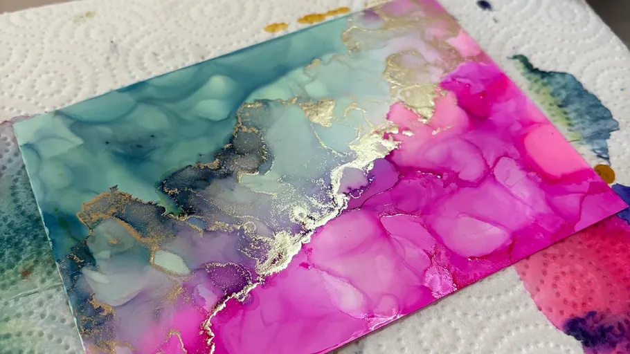 Colorful abstract painting on textured paper.