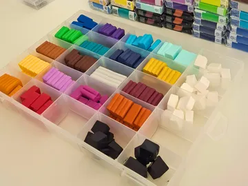Colored clay blocks arranged in a plastic organizer.