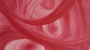 Abstract red swirls in close-up view.