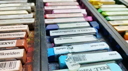 Colored pastels arranged in a tray.