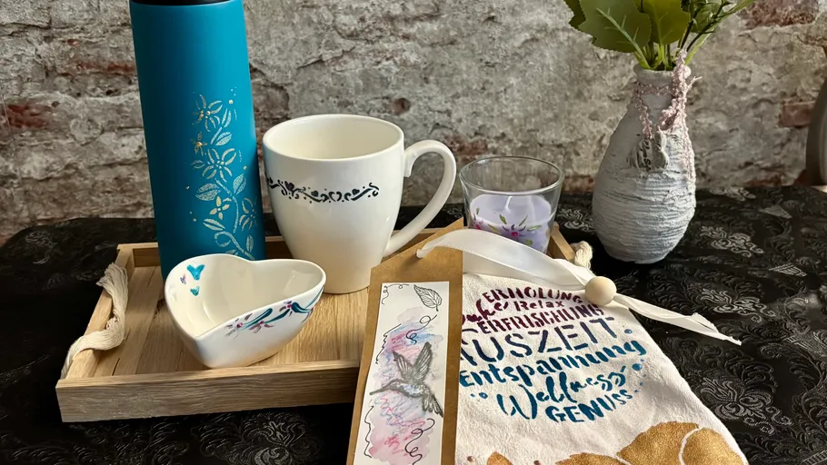 Gift items on tray with decorative elements.