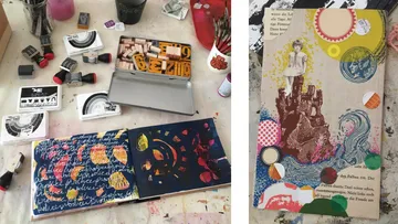 Art workspace with stamps and colorful journal.