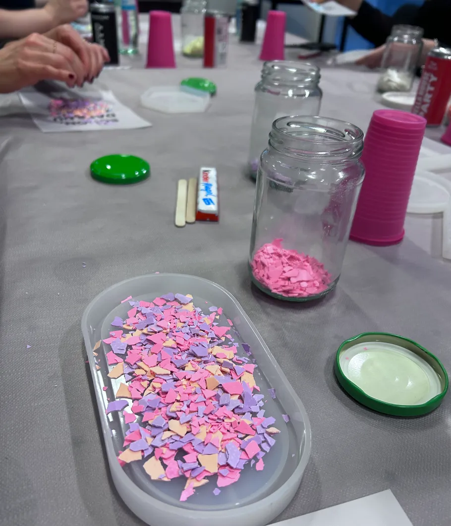 Colored wax pieces used in candle making.