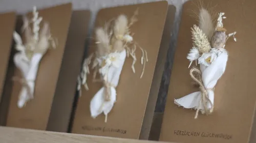 Greeting cards with dried flower decorations.