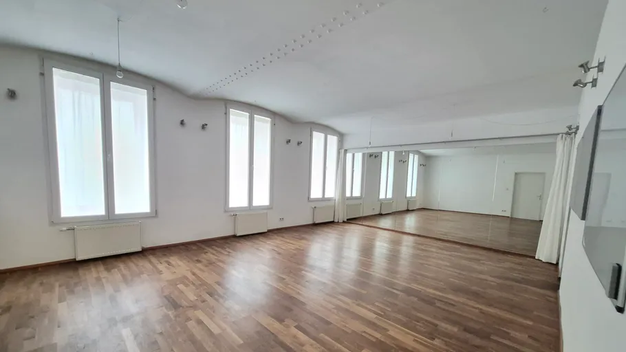 Empty dance studio with mirrored wall.