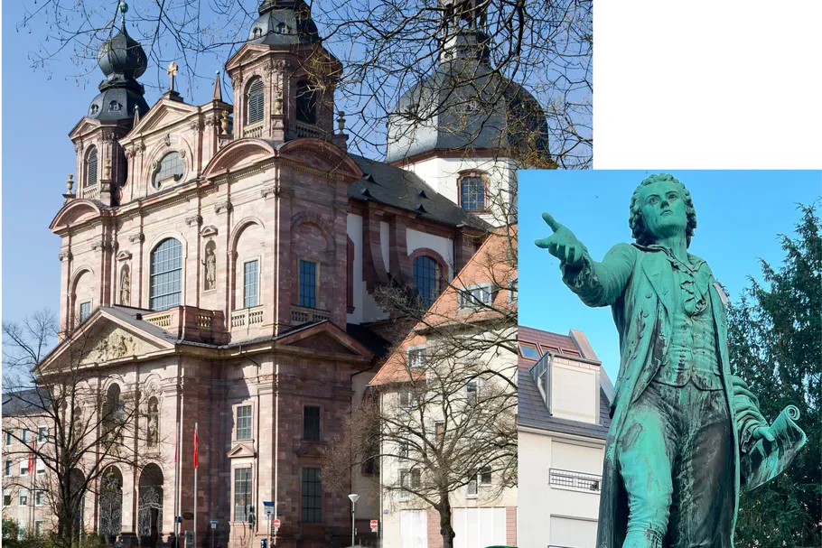Barocke Kirchenfassade und Bronzestatue im Freien.
