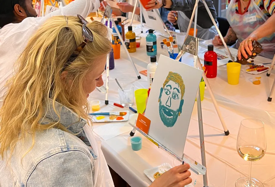 Woman painting face at art class.