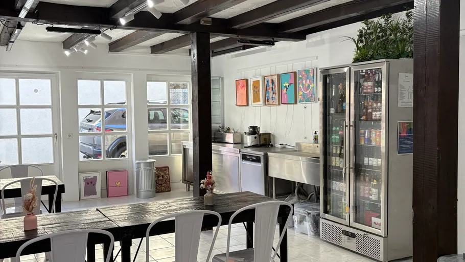 Cozy café interior with wooden beams.