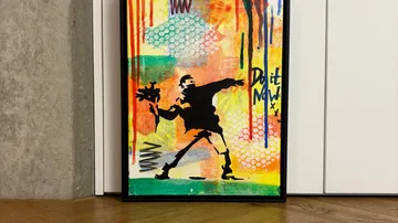 Framed graffiti-style artwork with vibrant colors.