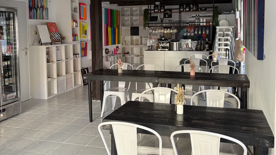 Cozy cafe interior with colorful decor.