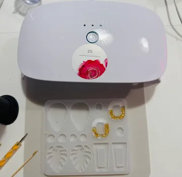 UV lamp curing resin mold below.