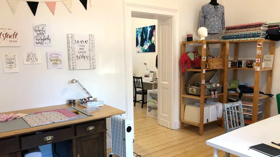 Craft room with sewing materials and decorations.