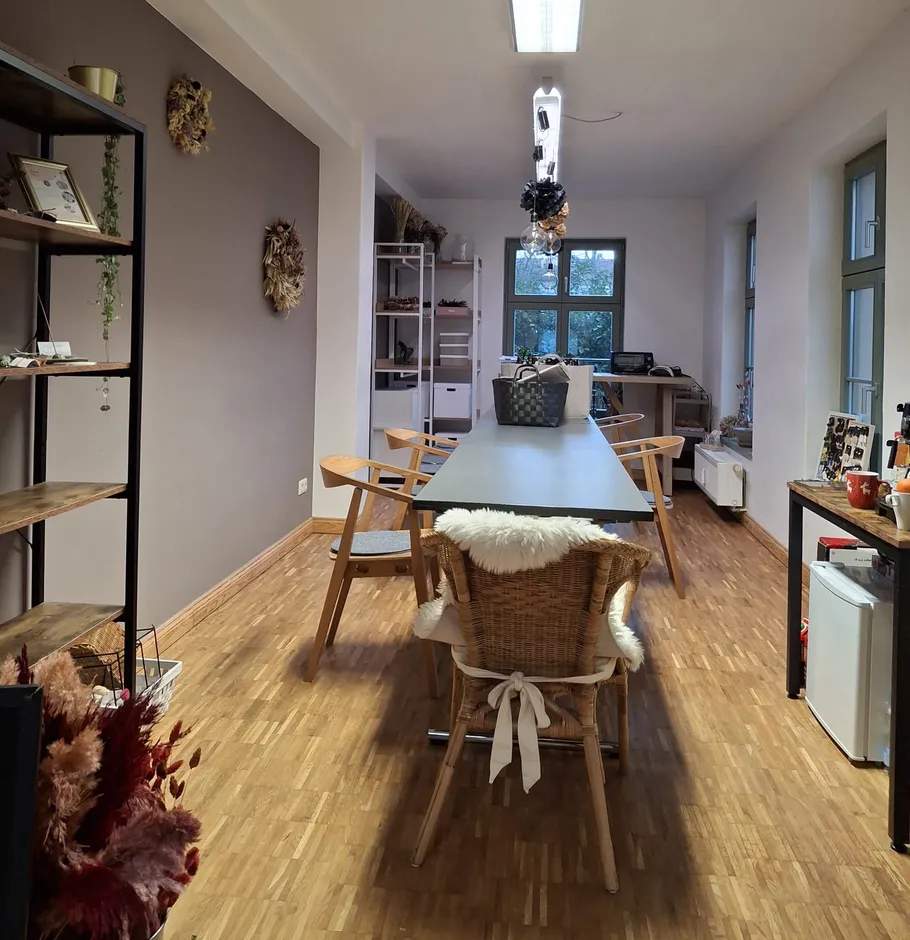 Modern office with long table and chairs.