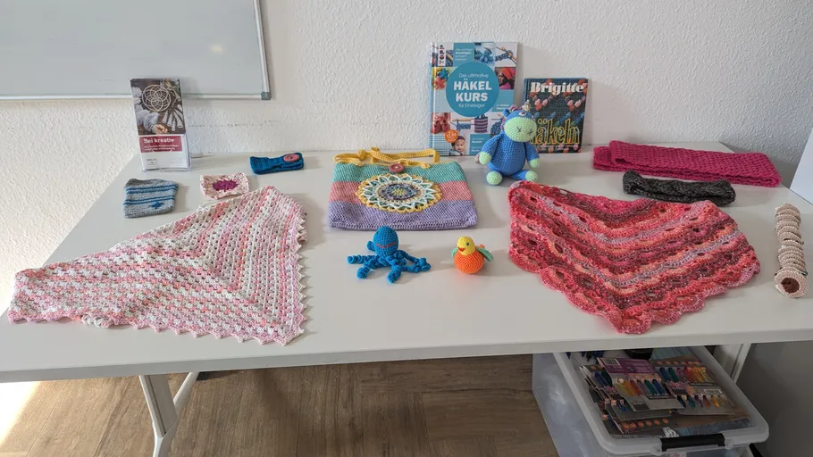 Crochet items displayed on a table.