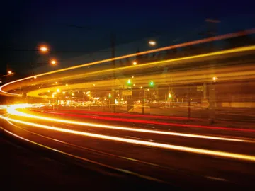 Vehicle lights move at night.