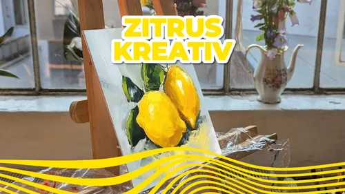 Lemon painting on easel near window.