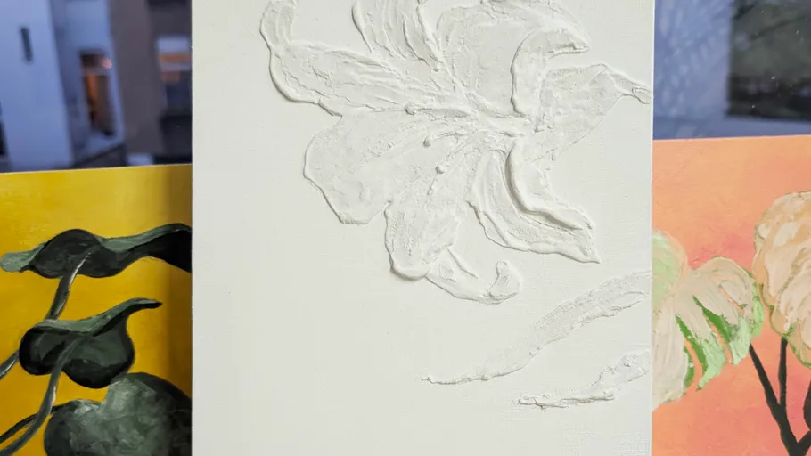 White embossed flower on textured canvas.