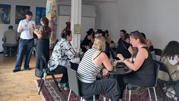 People conversing in a casual indoor setting.