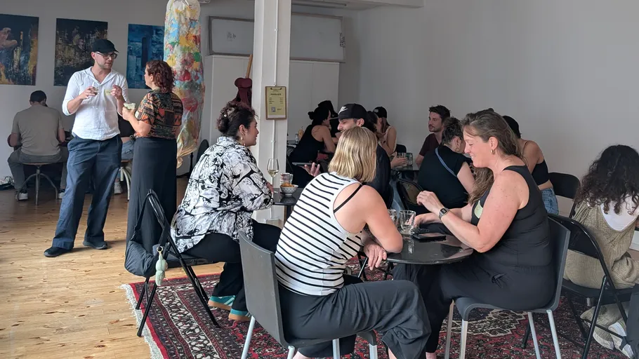 People conversing in a casual indoor setting.