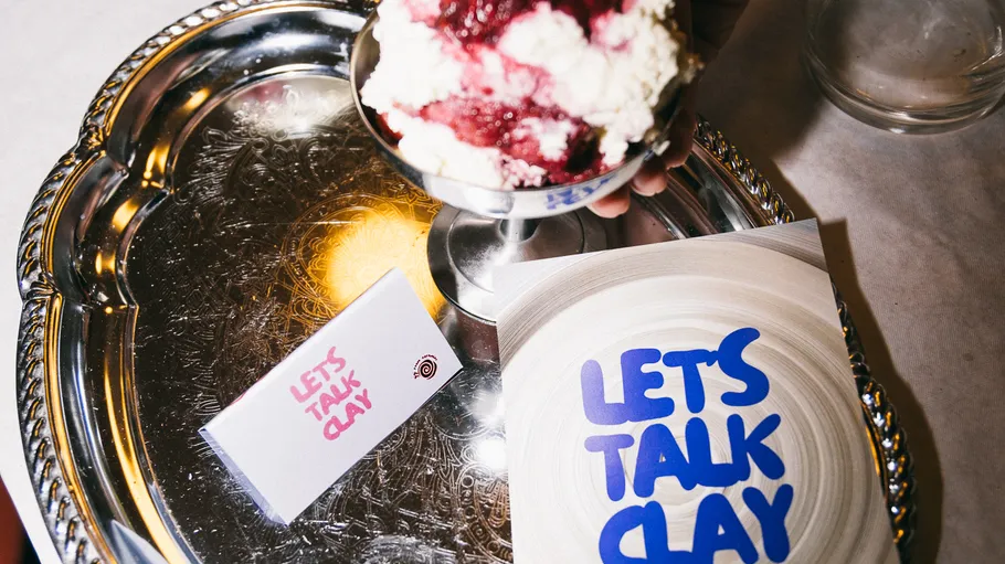 Dessert and cards on a silver tray.