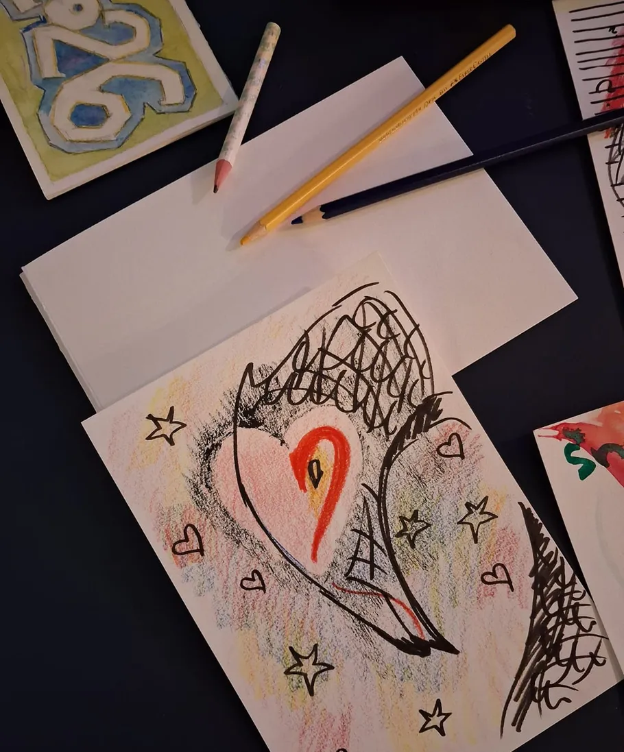 Colorful drawing on a dark surface.