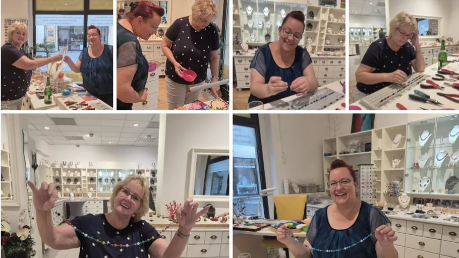 Two women making jewelry in a shop.